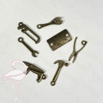 Set of 7 miniature bronze tools (between 20 and 25mm)